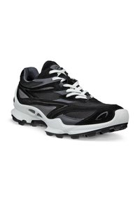 Black and gray athletic shoe with mesh and suede texture, white laces, padded collar, and a thick white midsole with a textured black outsole.