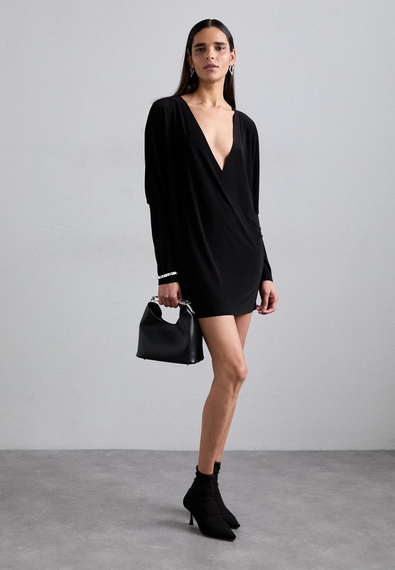 knee length dresses for ladies Norma Kamali Ruched stretch-jersey black mini dress - BOPF main image 0