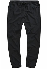 Pantalones deportivos negros con una textura suave, cinturilla elástica, cierre con cordón y bolsillos laterales con cremallera. Diseño de pierna ajustada.