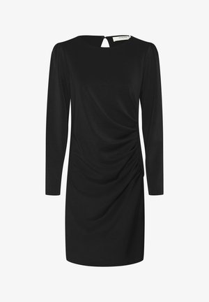 Abito nero in tessuto morbido con maniche lunghe, scollatura tonda e dettaglio drappeggiato sui fianchi con apertura a chiave sul retro.