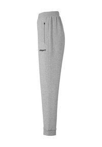 Grå sweatpants med elastisk talje, sidelommer med lynlås, manchetter ved anklerne og et lille sort "uhlsport" logo fortil.
