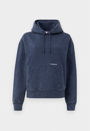 Marinblå hoodie i en blandning av bomull med en framficka, dragsko på huvan och en liten logotyp på bröstet. Mjuk, texturerad yta.