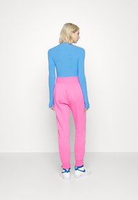 Nike Sportswear PHOENIX W NSW STYLE FLC HR PANT STD - Calças de fato de treino - pinksicle/sail