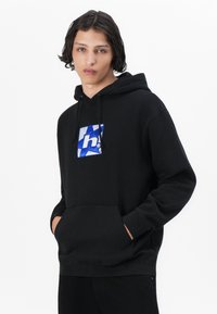 Black sweatshirt with hood, featuring a blue and white graphic design on the chest. Made from a soft material, with front pockets.
