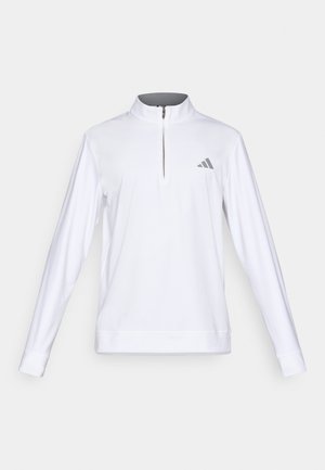 Bijeli pulover dugih rukava s polu-zip ovratnikom, sivi Adidas logo na lijevoj strani prsnog dijela i rebrastim manžetama, izrađen od glatkog materijala.