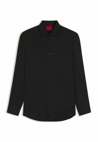 Camicia nera a maniche lunghe con bottoni, caratterizzata da un motivo testurizzato, colletto a punta e bottoni neri, con un'etichetta visibile all'interno del colletto.