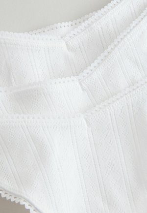 White lace-trimmed camisole featuring a textured design with narrow vertical stripes and diamond patterns, made from lightweight fabric.