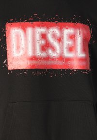 Black sweatshirt featuring a large, textured red and white logo with a dripping effect, centered on the chest. Includes a front pocket.