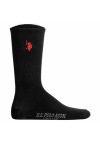 Calzini neri a coste realizzati in un materiale flessibile, presentano un logo rosso ricamato e testo grigio stampato "U.S. POLO ASSN. SINCE 1890."