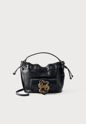 Black textured leather handbag with gold eyelets, drawstring closure, front pocket, and gold snake-shaped clasp labeled "just cavalli."