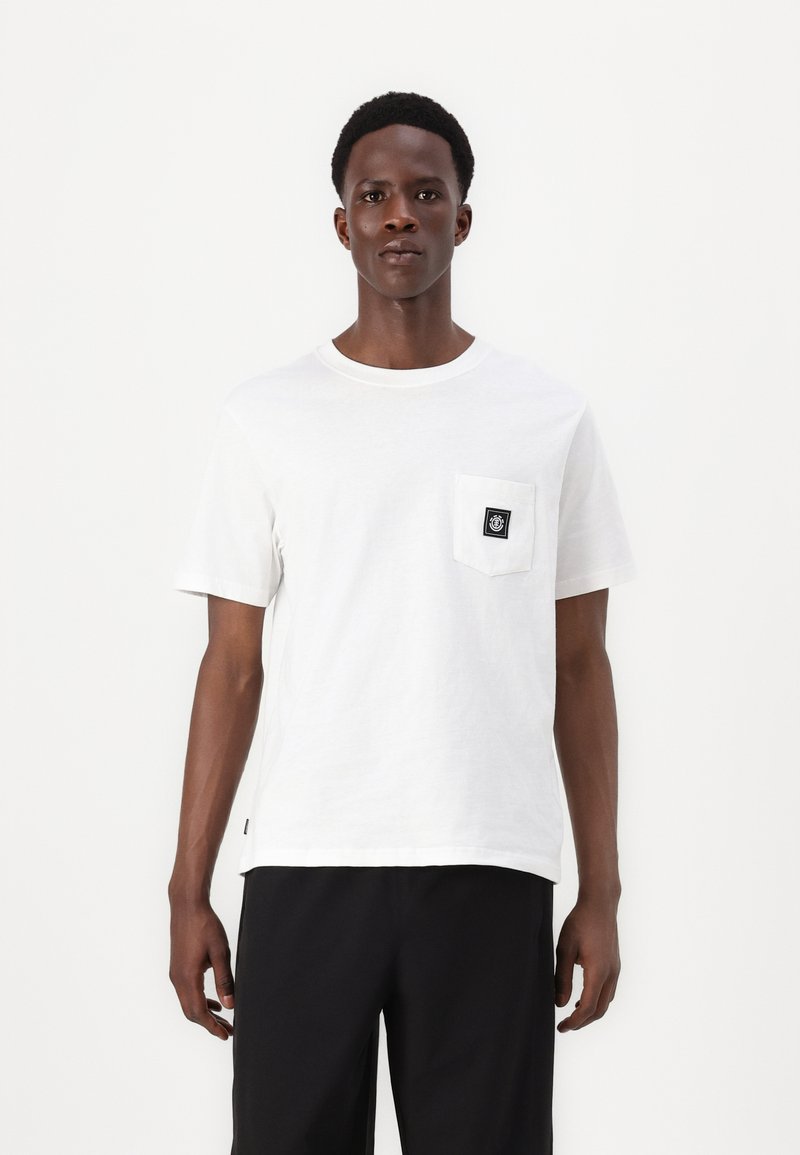 White cotton t-shirt featuring a round neck, short sleeves, and a left chest pocket with a black logo patch. Simple, straight cut design.