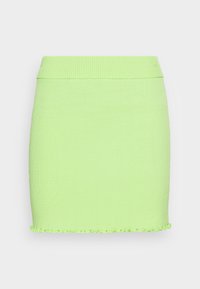 Ribbad kjol i ljusgrön med en åtsittande design, elastisk midja och en volangkant. Tillverkad av ett töjbart stickat tyg.