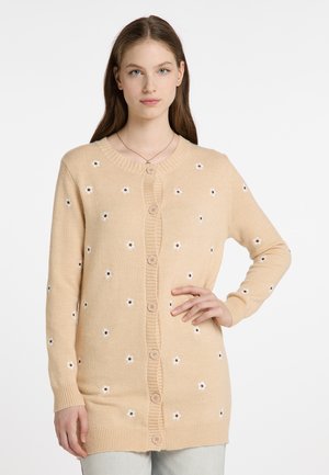 Beige cardigan valmistettu pehmeästä materiaalista, jossa on nappivienti ja kukkakirjonta, tekstuurilla varustettu ribbineck ja hihansuut.