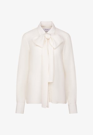 Witte blouse met lange mouwen van lichtgewicht stof, met een grote strik bij de kraag en knoopjes aan de manchetten. Soepele textuur.