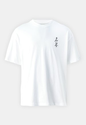White cotton t-shirt with short sleeves, round neck, and black printed text on the left chest area. Clean design, relaxed fit.