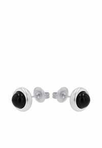 Pendientes de plata con un piedra de ónice negro redonda, de superficie suave y acabado pulido. Diseño clásico y minimalista.