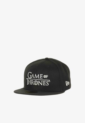 Black baseball cap featuring "Game of Thrones" logo in white embroidery. Structured shape with a flat brim and New Era logo on the side.