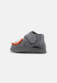 Gray felt slipper with a rounded toe, Velcro strap, and an orange and beige lion face decoration. Textured sole for traction.