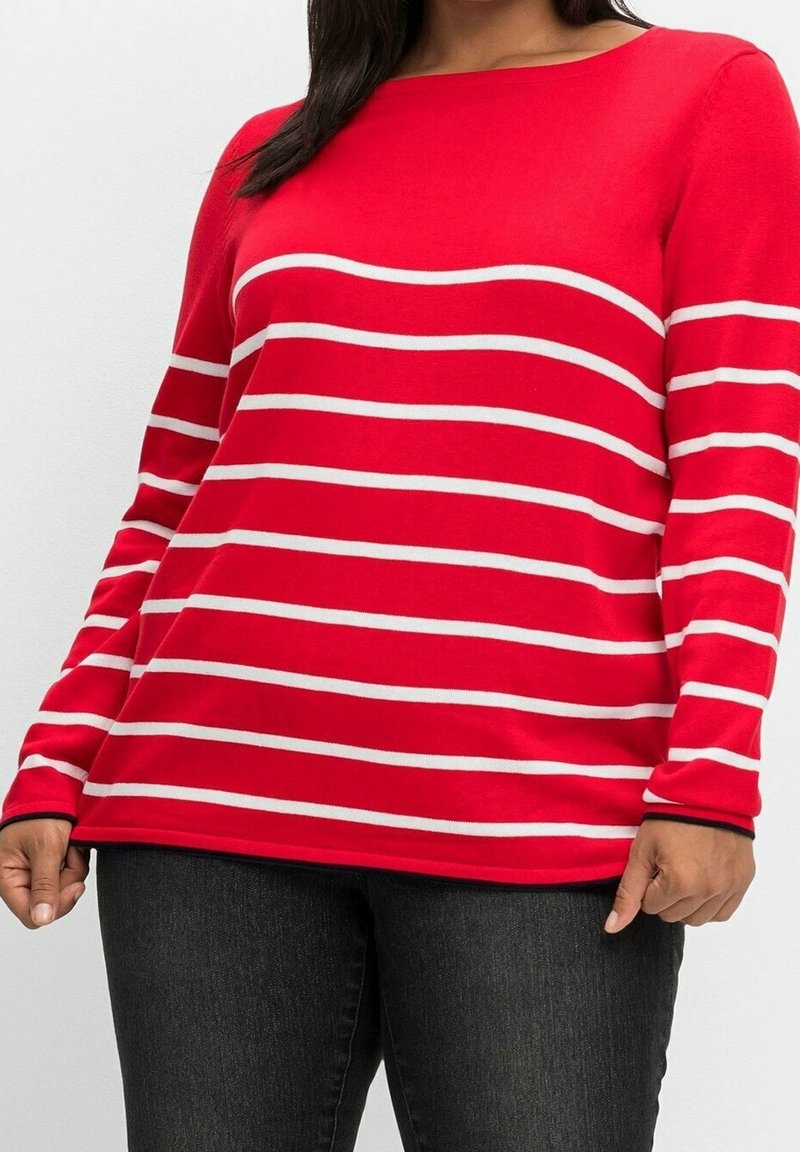 Rotes Langarmshirt mit weißen horizontalen Streifen. Rundhalsausschnitt und weicher Stoff. Der Hauptkörper hat eine lockere Passform. Kombiniert mit dunkler Jeans.