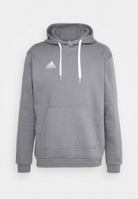 Sweatshirt à capuche gris avec cordons blancs, poche kangourou à l'avant et logo Adidas blanc sur la zone de gauche de la poitrine. Matière douce en mélange de coton.