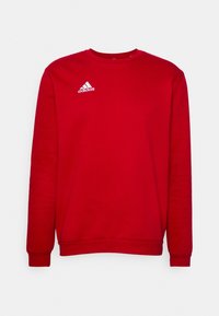 Rode sweatshirt van zacht materiaal, met een ronde hals, lange mouwen en een wit Adidas-logo op de bovenste linker borst.