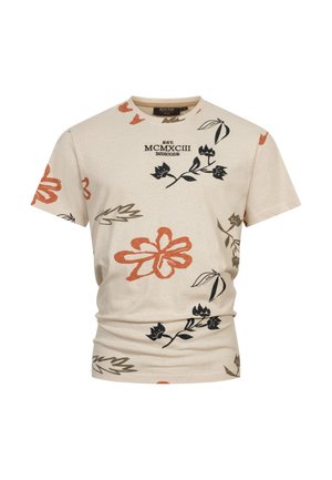 Beige katoenen t-shirt met bloemmotieven in oranje, zwart en groen. Heeft een ronde hals en korte mouwen. Merken op de voorkant.