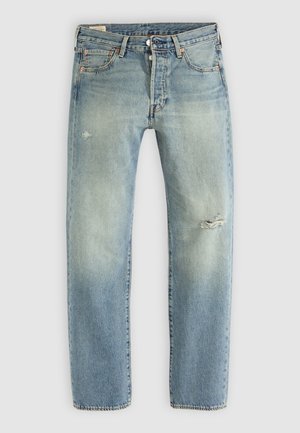 Light blue denim jeans with a straight leg, five pockets, button fly, and small distressed tears on left thigh and right knee.