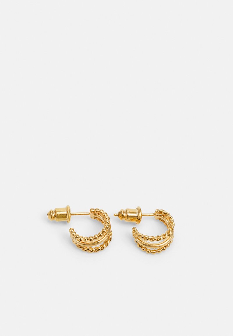 Orecchini Huggie Hoop in oro con occhio della fortuna | Classy Women Orecchini Huggie Hoop in oro con occhio della fortuna | Classy Women