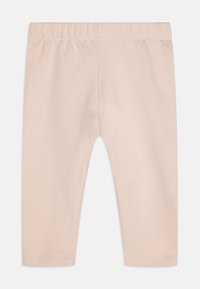 Lyserøde tights laget av myk bomull, med elastisk linning, rett snitt og uten ekstra pynt.
