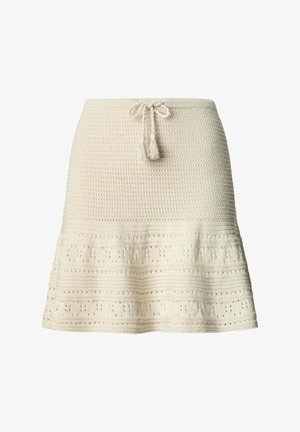 Falda de punto color crema con patrones texturizados y cintura con cordón con extremos de borlas, ligeramente acampanada en el dobladillo.