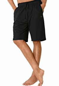Black swim shorts with an elastic waistband, adjustable drawstring, two side pockets, and smooth fabric texture. Mid-thigh length.