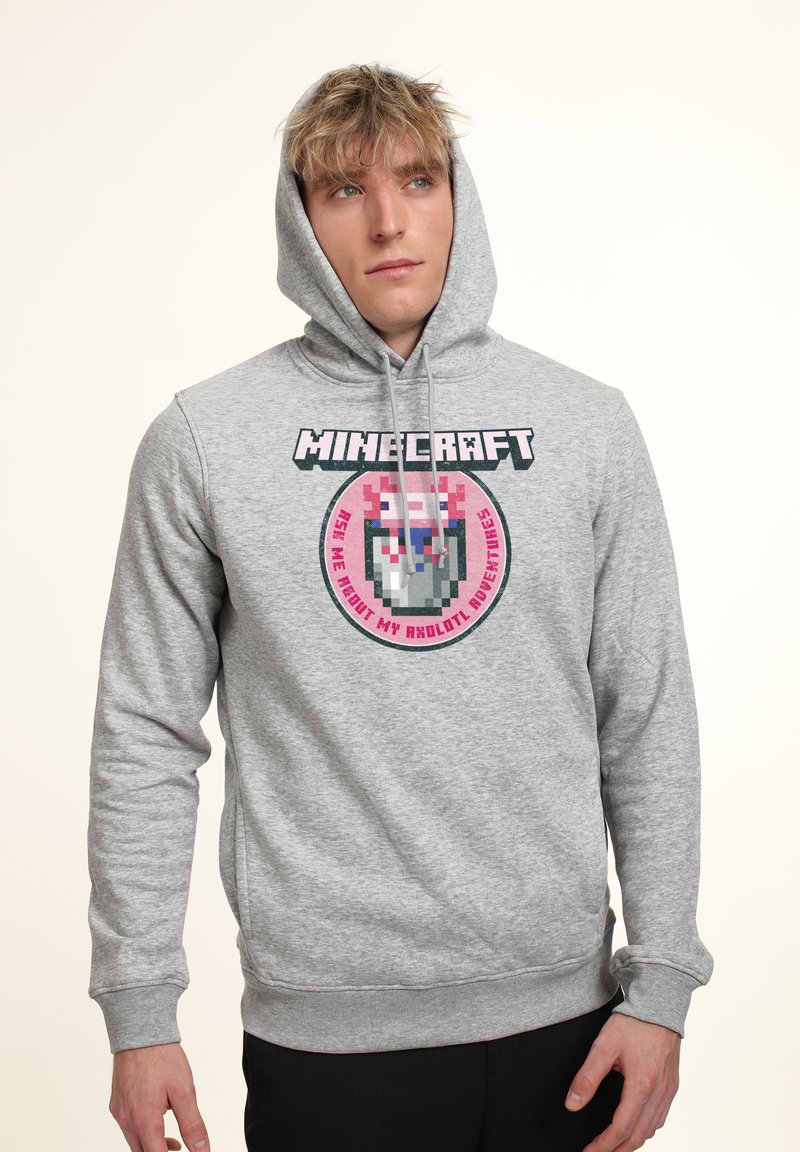 Felpa grigia con grafica di un personaggio pixelato di Minecraft. Cappuccio con lacci, polsini a coste e design con tasca a canguro.