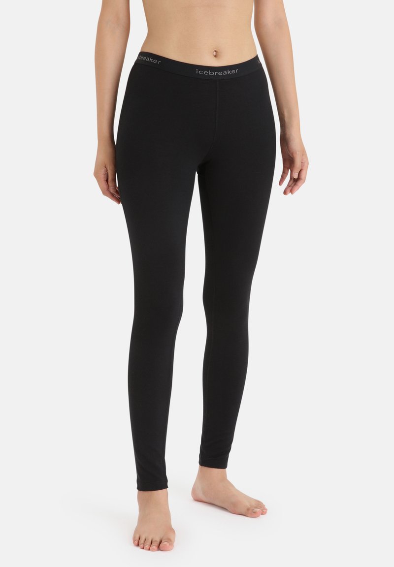 Black leggings made from a smooth, stretchy fabric with a fitted design. Features a wide waistband with "icebreaker" logo.