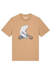 Tanshirt van katoen met een graphic van een beer die op een blauwe fiets rijdt, met gedetailleerde zwarte lijntekeningen aan de voorkant.