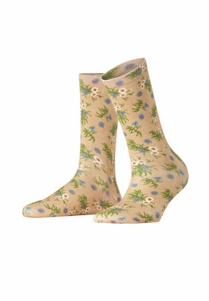 Beige Baumwollsocken mit einem floralen Muster, das blaue und weiße Blumen sowie grüne Stängel zeigt, und einer glatten Textur.
