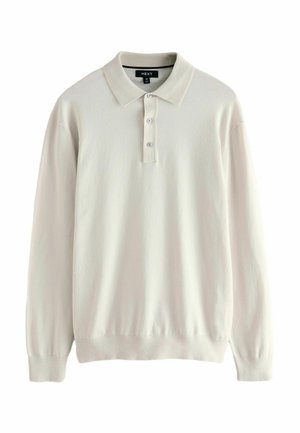 Polo shirt a maniche lunghe color beige chiaro con colletto, tre bottoni e polsini elasticizzati. Texture morbida e design classico.