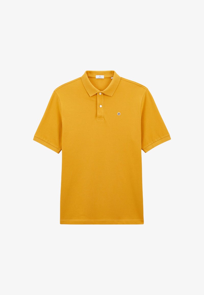 Polo shirt jaune en coton, doté d'un col classique, de deux boutons et d'un petit logo sur la poitrine gauche. Manches courtes.