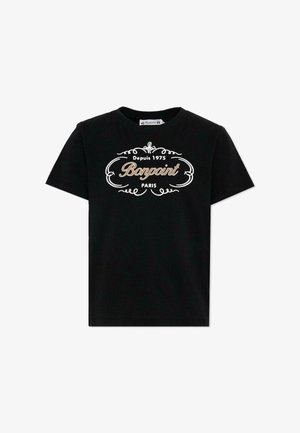 Czarny t-shirt z krótkim rękawem z dekoracyjnym białym i złotym napisem "Depuis 1975 Bonpoint Paris" na przodzie.