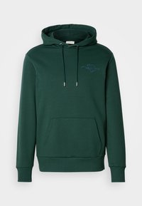 Felpa verde scuro in morbido cotone, con tasca frontale, cordini regolabili e un logo testurizzato sul petto.