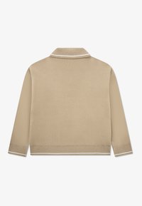 Beige knitted sweater with a collar, featuring white accent trim on the collar and hem. Long sleeves with a smooth texture.