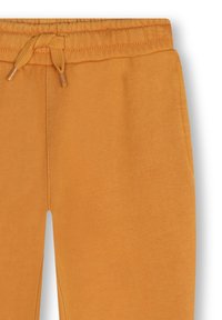 Oranje katoen sweatpants met een elastische tailleband en verstelbaar trekkoord, voorzien van zijzakken en een gestructureerde stofafwerking.