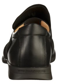 Zwarte leren schoenen met een ronde achterkant, een gladde oppervlakte en gestikte details. De binnenvoering is beige. Heeft een flexibele rubberen zool.