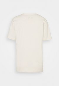 COACH T-shirt med print - light yellow