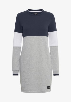 Ilga rankovė suknelė tamsiai mėlynos, pilkos ir baltos spalvų. Apvalus iškirpimas su spalvų blokų dizainu. Minkšta medžiaga, su logotipo paketu apačioje.
