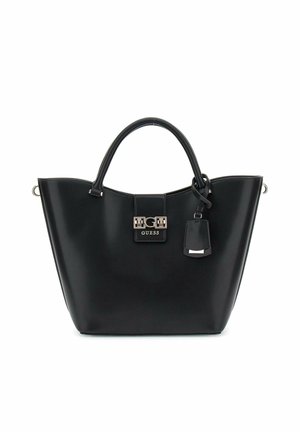 Bolso de mano sintético negro con forma estructurada, doble asas, un acento de logo en metal plateado y una etiqueta desmontable. Textura suave.