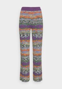 Barevné vzorované dámské kalhoty s širokým pasem, vertikální pruhy v purpurové, oranžové, zelené a černé tkanině.