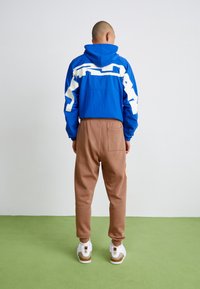 Jordan Trainingsbroek - archaeo brown/orange chalk
