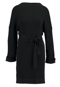 Zwarte geribbelde gebreide jurk met een bootnek, lange mouwen en een strikriem in de taille. Voorzien van omgeslagen manchetten en een rechte zoom.