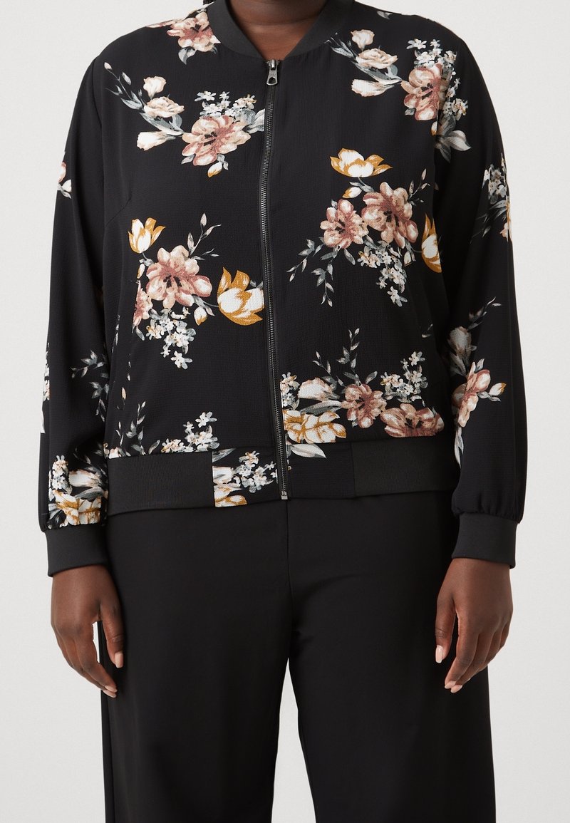 Černá bomber bunda s květinovým potiskem v odstínech růžové a žluté, s předním zipem, žebrovanými manžetami a lemem. Texturovaná látka.