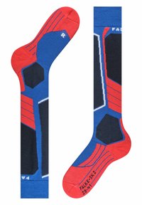 Calzini blu e rossi con un design geometrico caratterizzato da motivi esagonali e strisce; realizzati in tessuto con una superficie liscia.